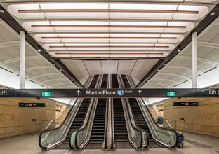 4 Escalators with the Martin Place sign in front