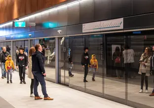 People walking around the open day also showing the platform screen doors