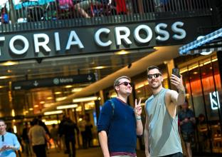 two people taking a selfie at the Victoria Cross Station