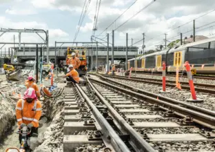 a group of people on a train track