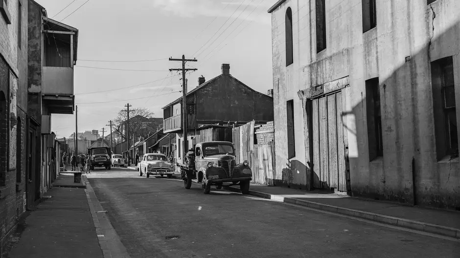 Black and white photo of an old car parked on Wellington Street in 1961.