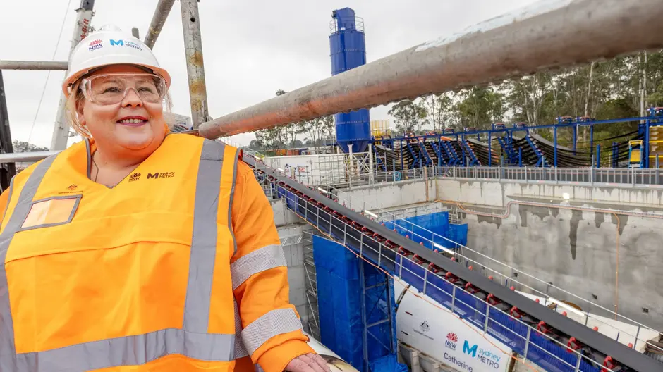 Catherine White standing in a Sydney Metro construction site wearing safety gears