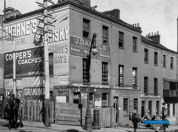 Black and white photo of a building on the South-west corner of Hunter and Elizabeth Streets