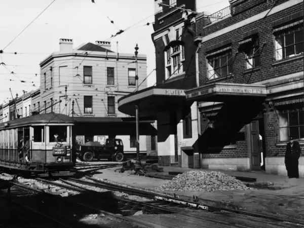 Old black and white photo of a tram going down Regent Street in Sydney.