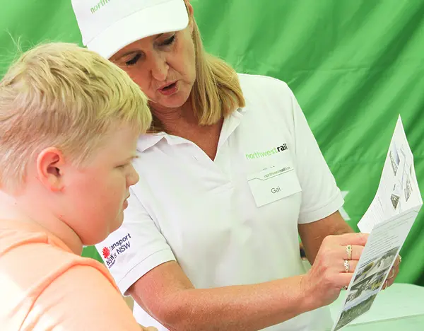 Staff member talking with boy