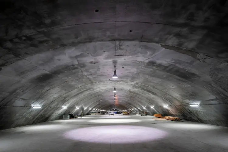 A view from inside the Barangaroo Cavern Plenum looking down the long tunnel that's lit up with spotlights.