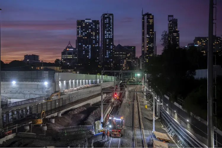 Northern Connection construction site at night. There is silhouettes of buildings in the background