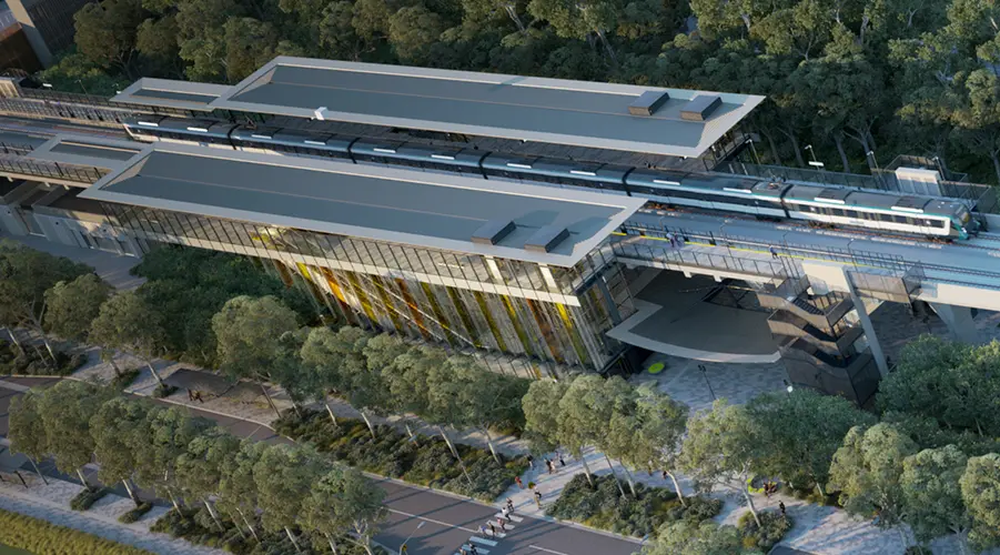 Artist's impression of an aerial view over Kellyville Station, lots of trees and greenery feature around the leaf-shaped station.