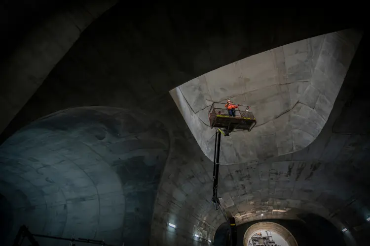 Construction worker in high viz on the top of a crane in the Martin Street Cavern