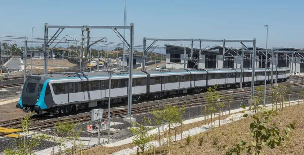 An arial view looking at a Sydney Metro train being tested along the tracks. 