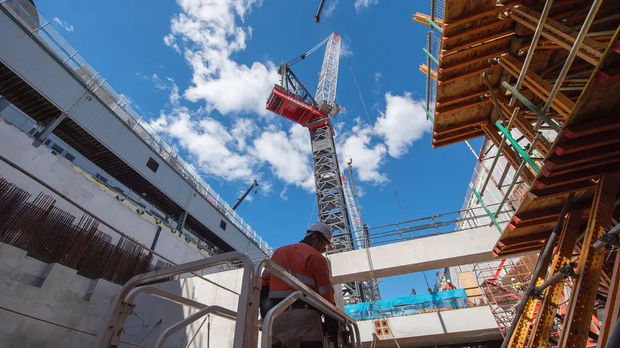 A ground up view of construction work and crane tower at Sydney Metro's Crows Nest Station.