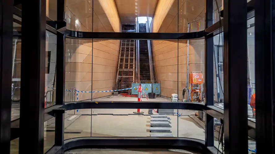 Central Station escalators as viewed from inside a lift through glass windows