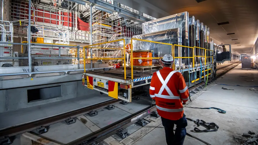 HyRail truck carrying platform screen doors through an underground tunnel