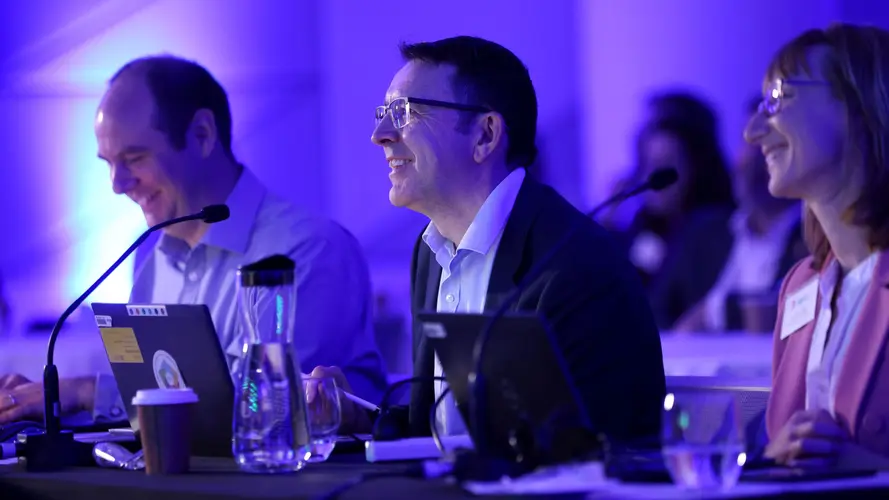 A close up shot of the 3 smiling members of the Sydney Metro Judging panel.