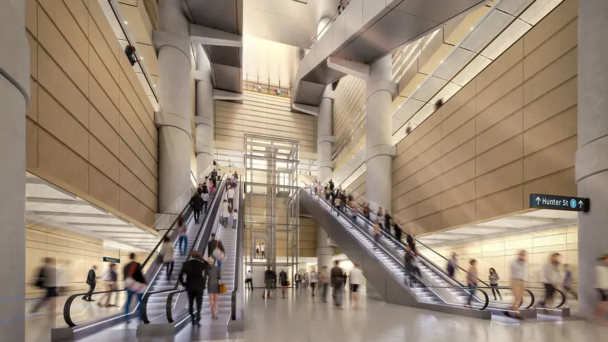 Customers using two escalators inside building atrium