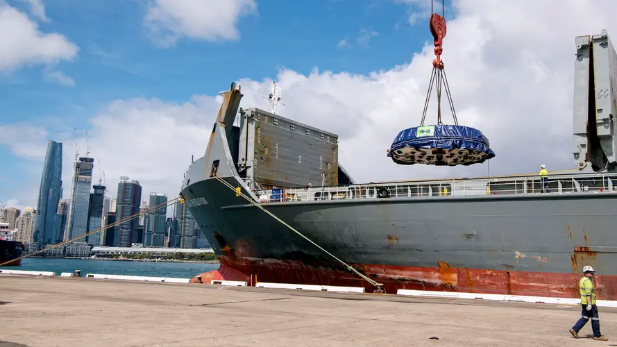 Cargo shit unloading cutterhead component from a tunnel boring machine (TBM) onto dock