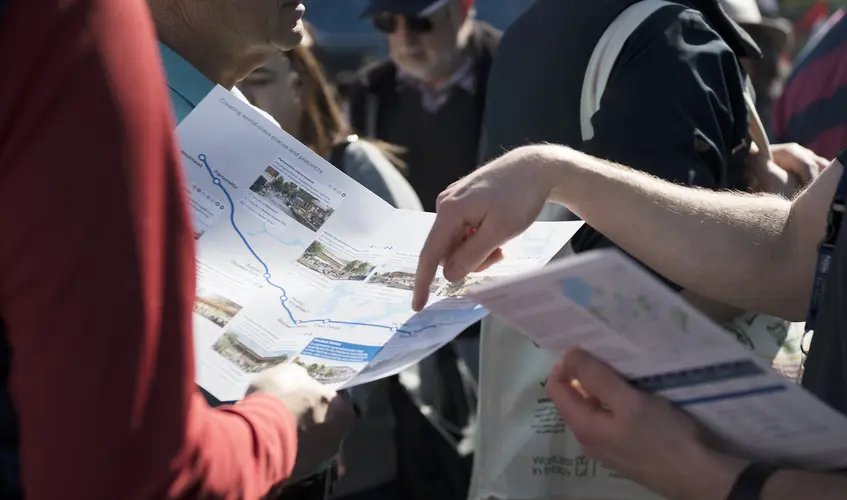 Sydney Metro team member pointing at a map of the Sydney Metro alignment