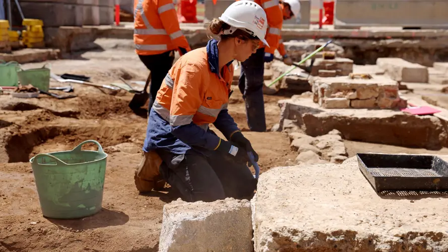 An on the ground view looking across at the excavation site where archaeological work is being completed at Sydney Metro's Parramatta construction site.