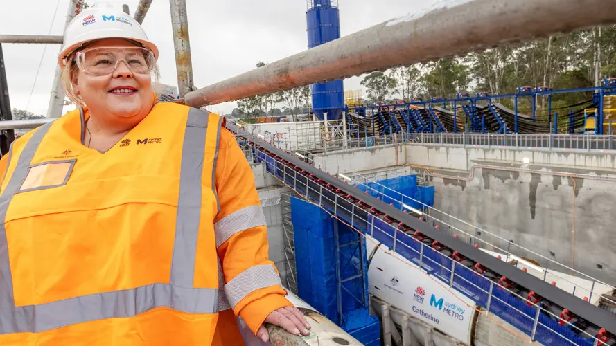 A worker standing on a construction site of a TBM