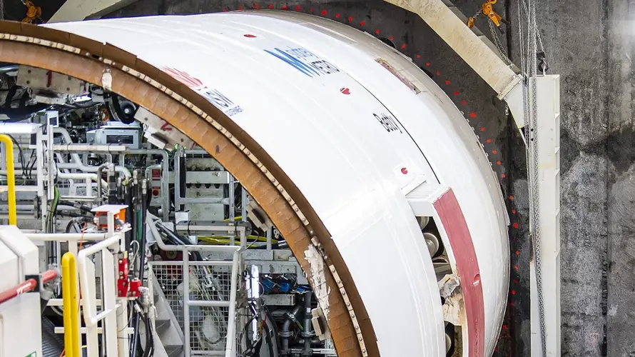 a worker standing beside the newly launched TBM Betty