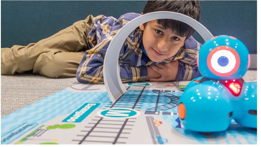 A boy playing at the school holiday program