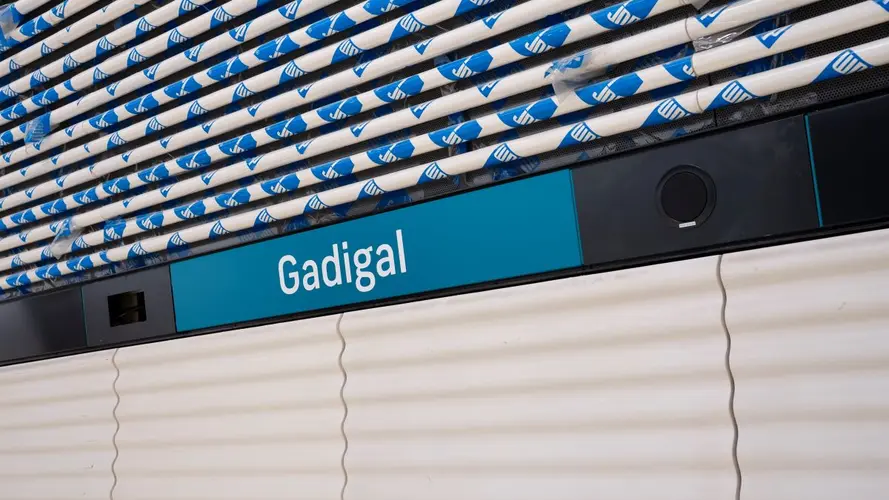 Signage of Gadigal station  in white letters on blue background, which is Sydney Metro's brand color