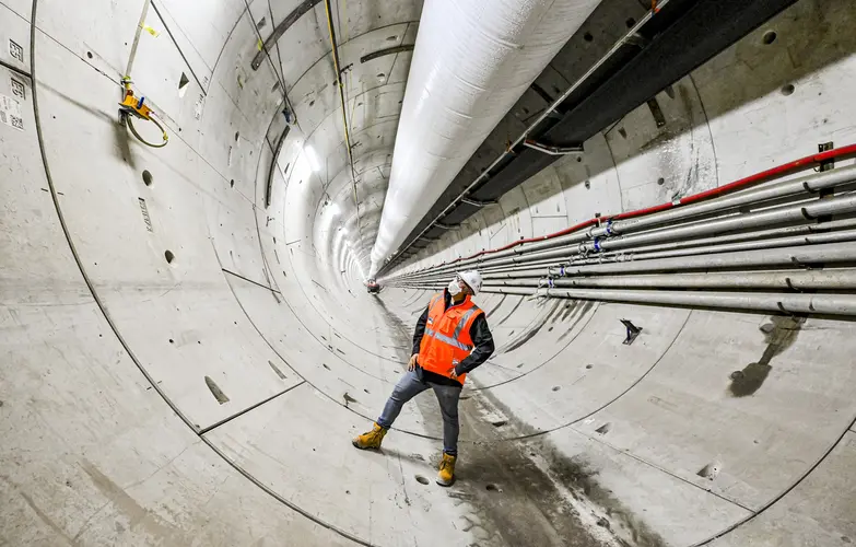 Man in high-vis vest inside tunnel at Airport Business Park