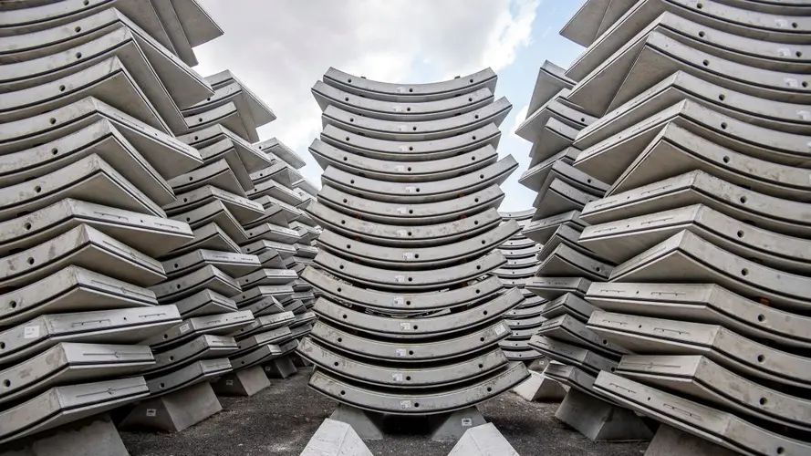 Piles of of grey coloured precast segments