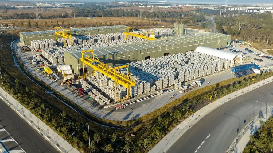 a wide angle photo of the Eastern Creek facility is taken by a drone that is showing piles of segments one after another in a large area