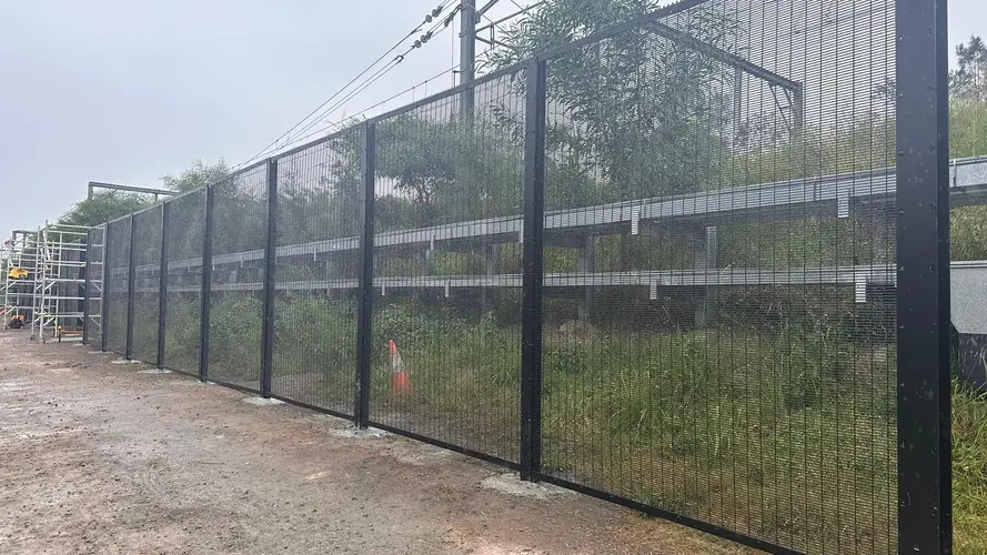 Black fence is being set up as the T3 Bankstown Line is being prepared for its final conversion 