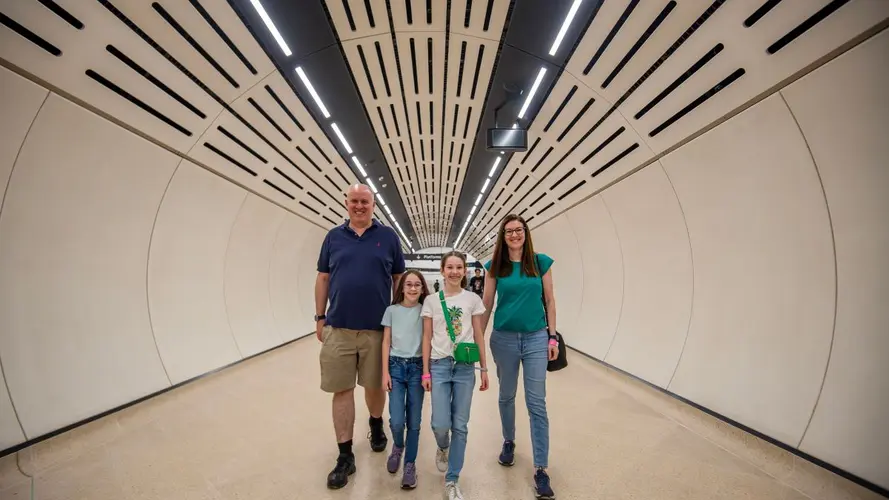 Family walking through the station