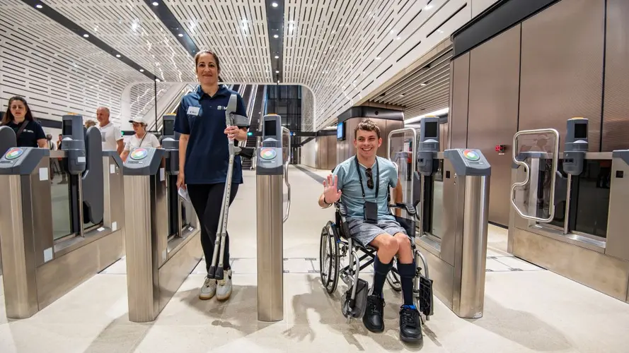 Boy in a wheelchair going through the opal gates