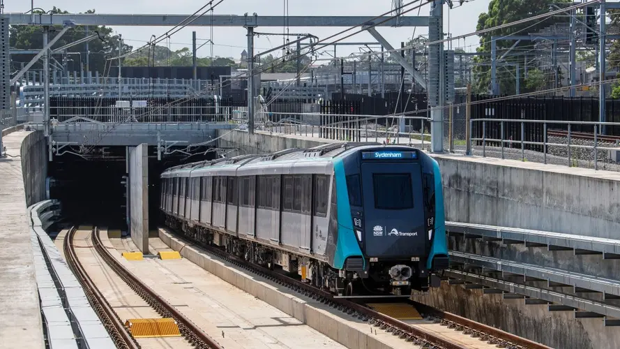 a metro train in color blue is on tracks for testing