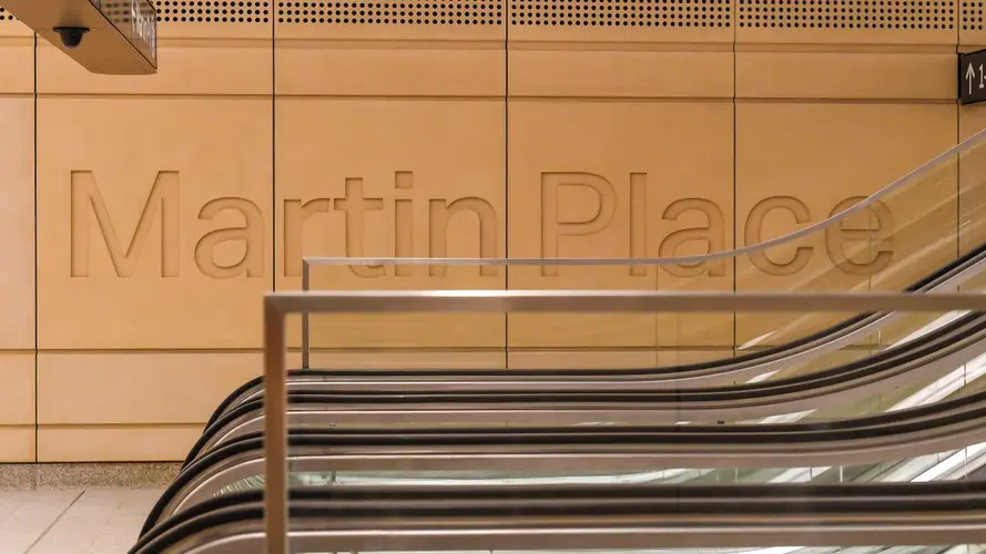 The words Martin Place indented on a wall at the station