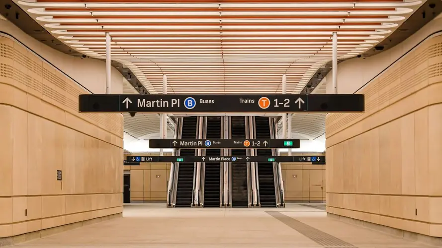 Signs going towards the escalators 