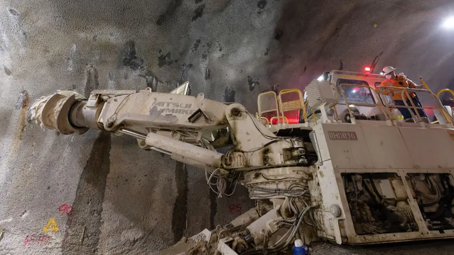 Man operating a machine in the tunnel