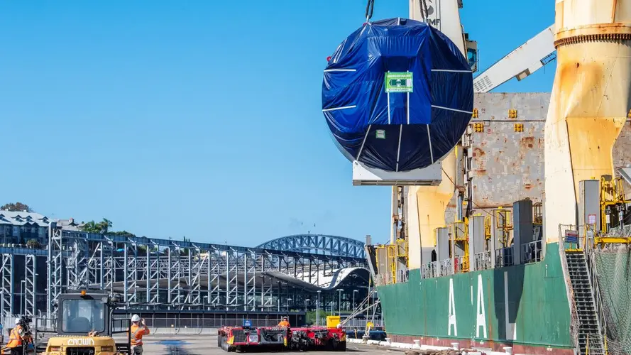 TBM attached to a crane arriving on site