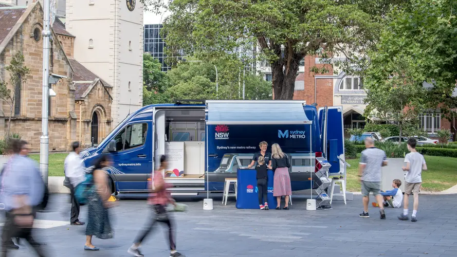 Image of Sydney Metro Van with people walking in front 