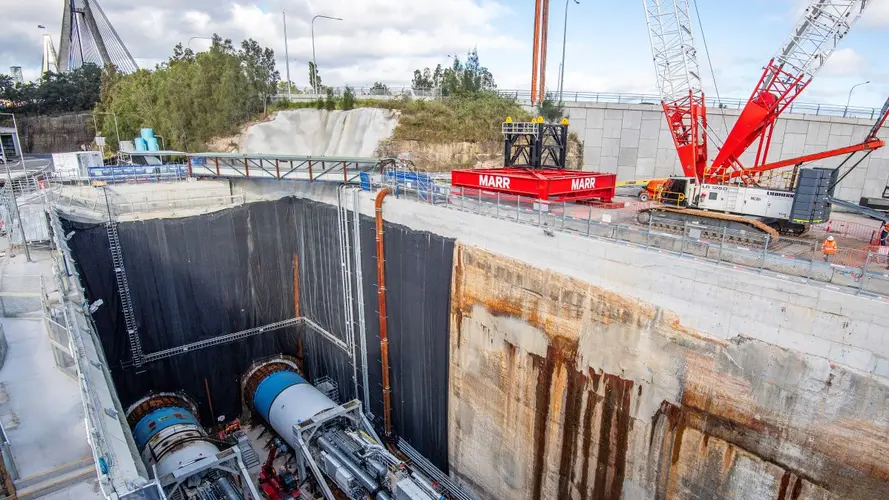 Construction site with cranes around the TBM's