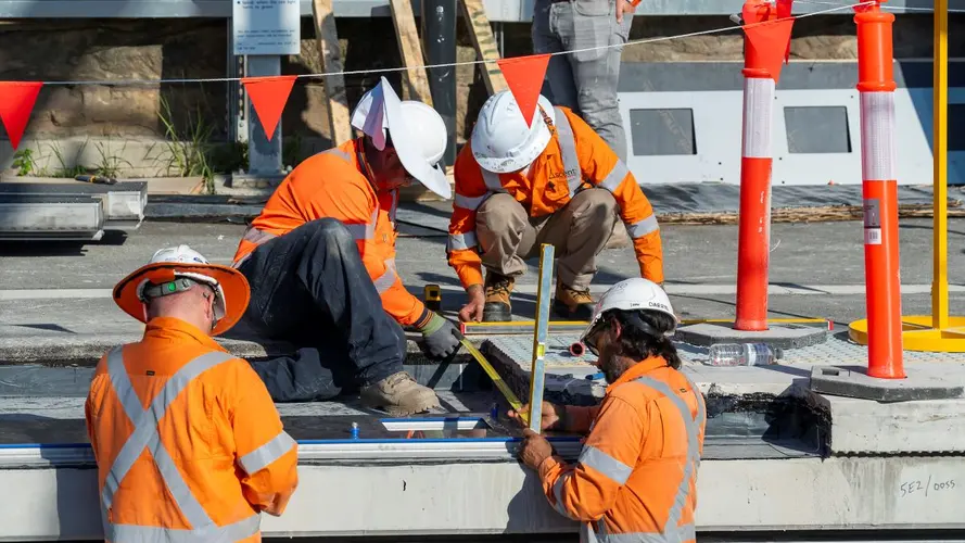 4 workers in high vis gear installing MGF at Hurlstone Park 