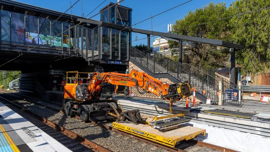 Orange machine installing the mechanical gap filler at the station