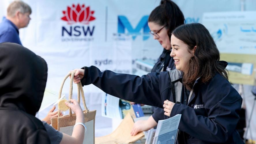 Sydney Metro workers handing out showbags