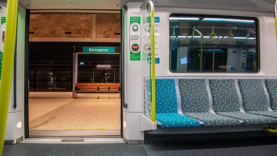 Image from inside a Metro carriage with the doors open showing the Barangaroo station sign on the platform 