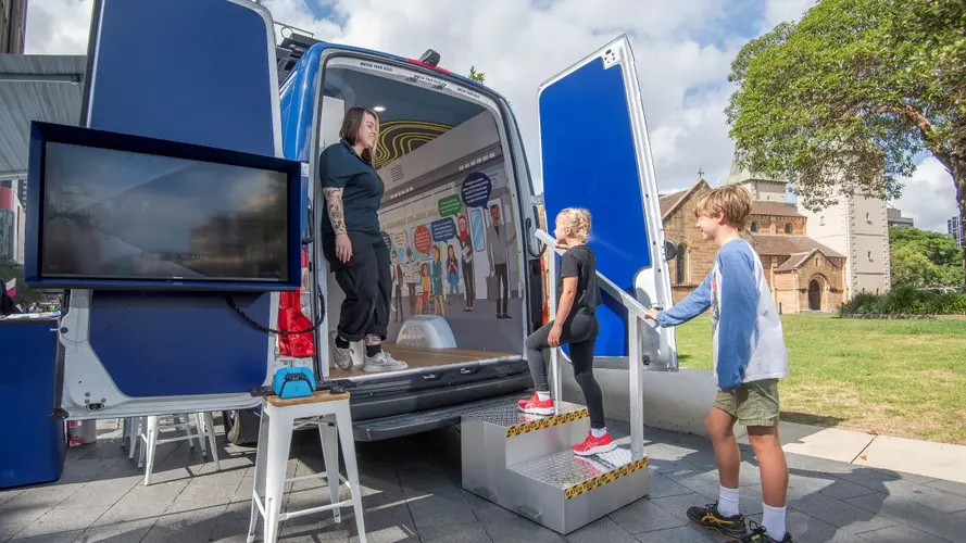 Sydney Metro Community Engagement Van with open doors at an event