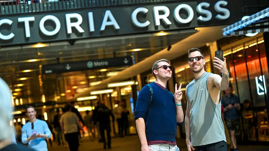 two people taking a selfie at the Victoria Cross Station